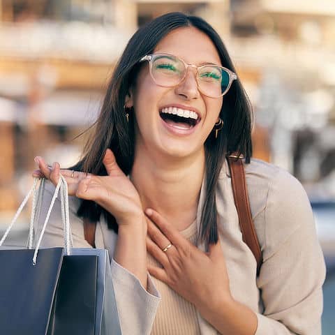 A happy shopper outside the store